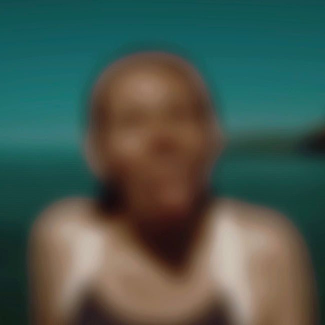 Blurred image of a person against a natural background